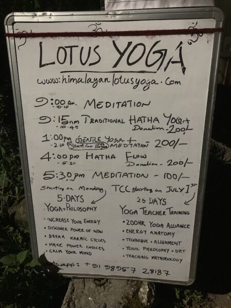 A yoga schedule of daily drop ins from Lotus Yoga in Dharamkot.